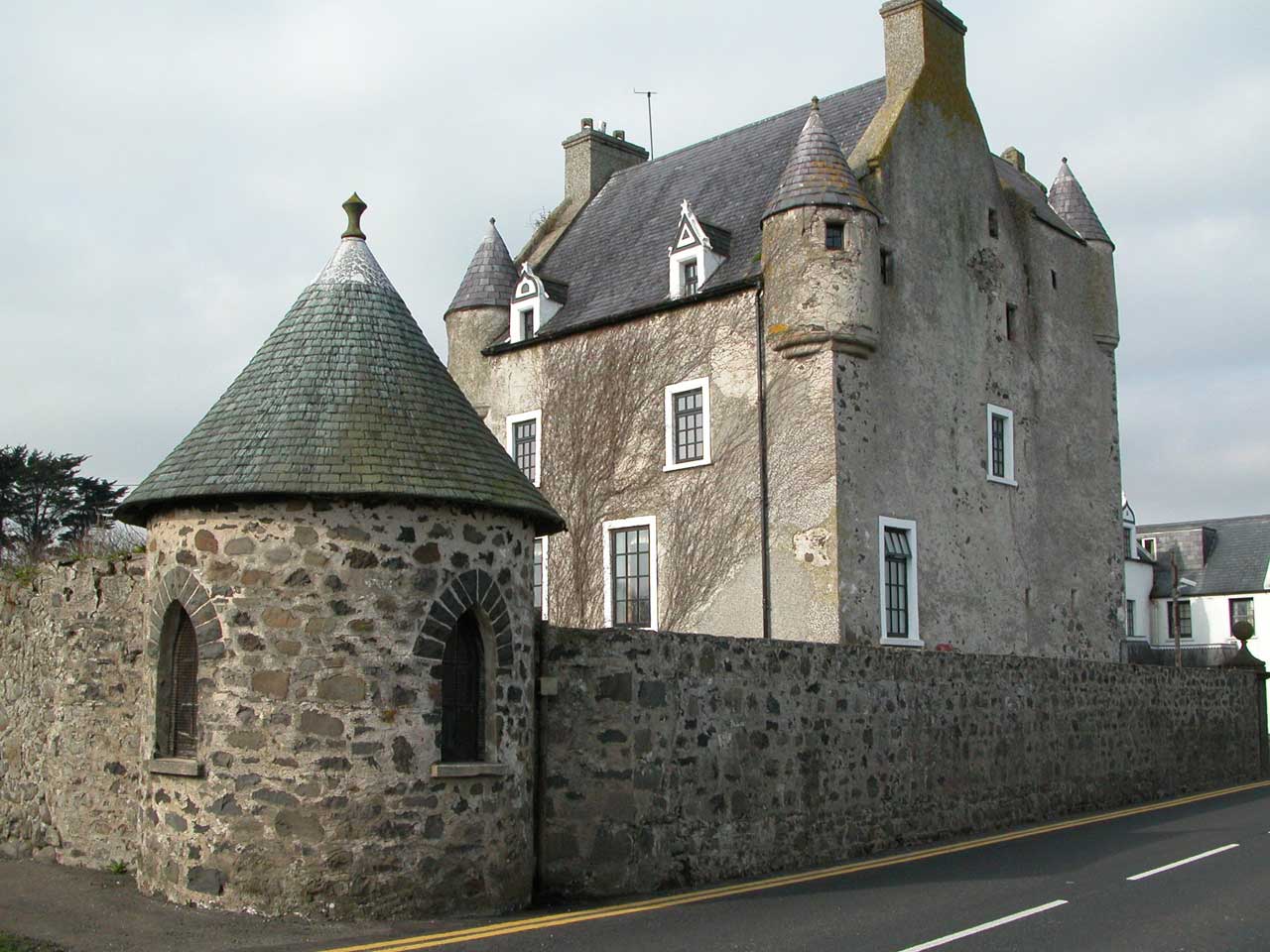 Ballygally Castle with its conical turrets and stone garden tower beside the Antrim Coast Road